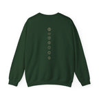 Back of a crewneck showing seven chakra symbols down the spine