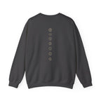 Back of a crewneck showing seven chakra symbols down the spine