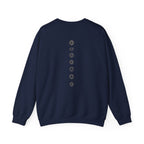 Back of a crewneck showing seven chakra symbols down the spine