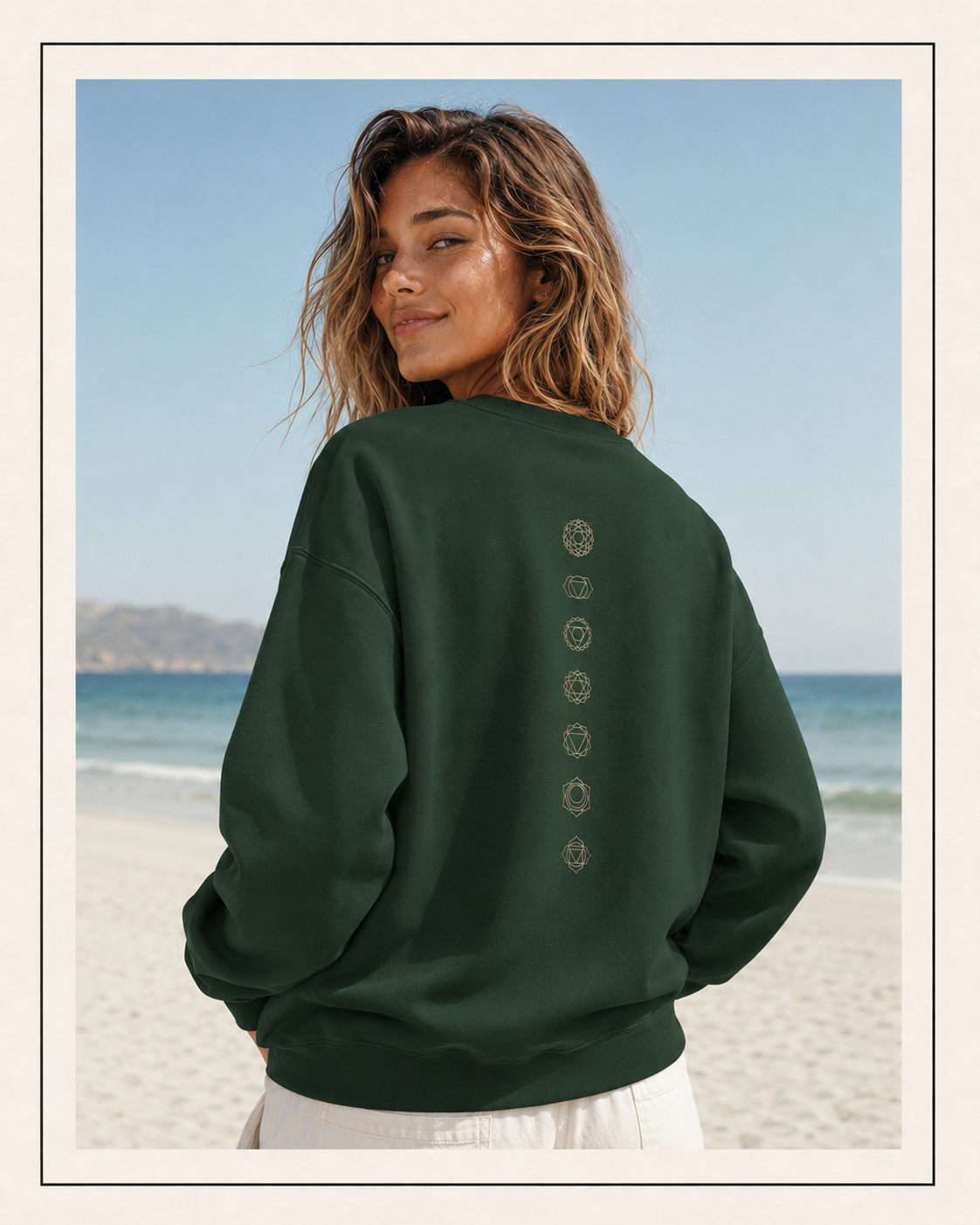 Back of a crewneck showing seven chakra symbols down the spine