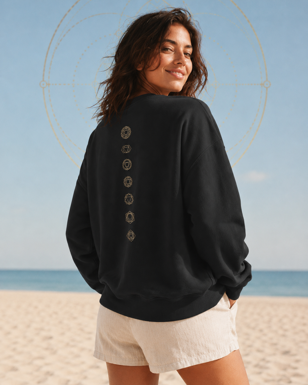 Back of a crewneck showing seven chakra symbols down the spine