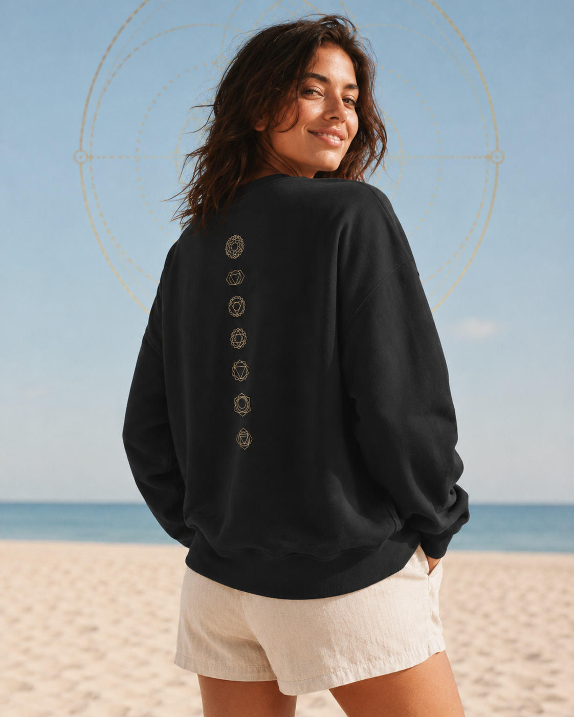 Back of a crewneck showing seven chakra symbols down the spine