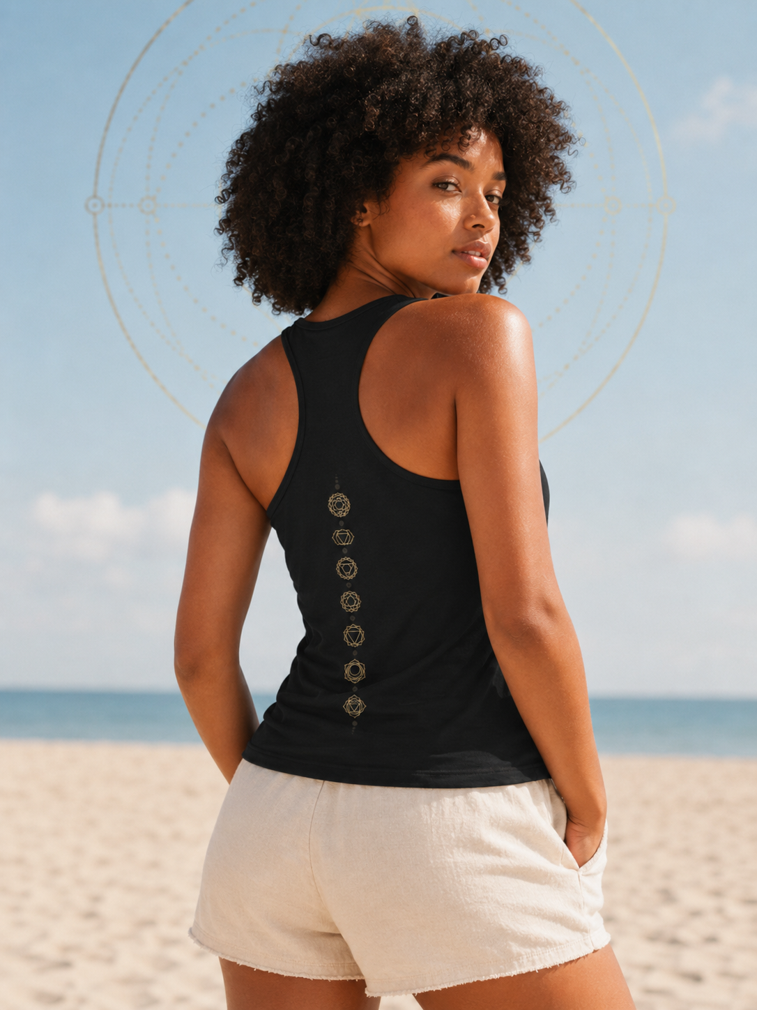 Back of a racerback tank showing seven chakra symbols down the spine