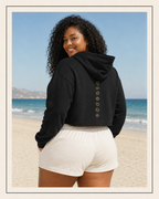 Back of a crop hoodie showing seven chakra symbols down the spine