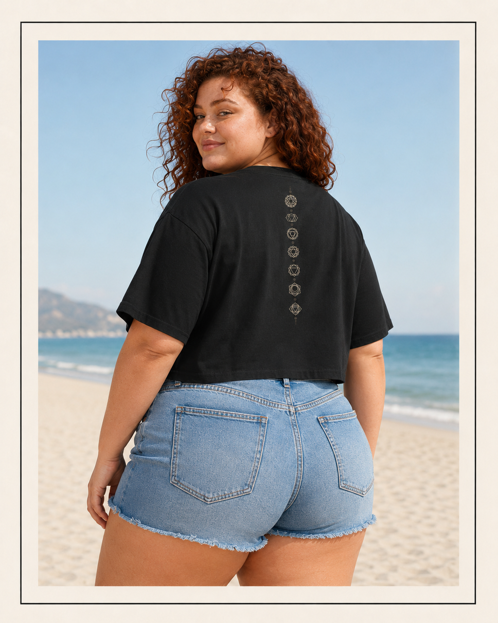 Back of a crop tee showing seven chakra symbols down the spine