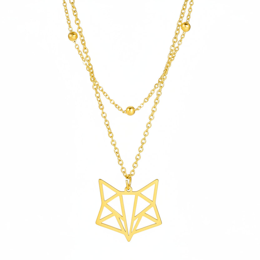 Gold geometric pendant necklace with chain on a white background