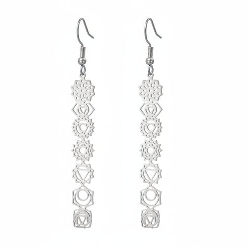Pair of silver earrings with geometric design on a white background