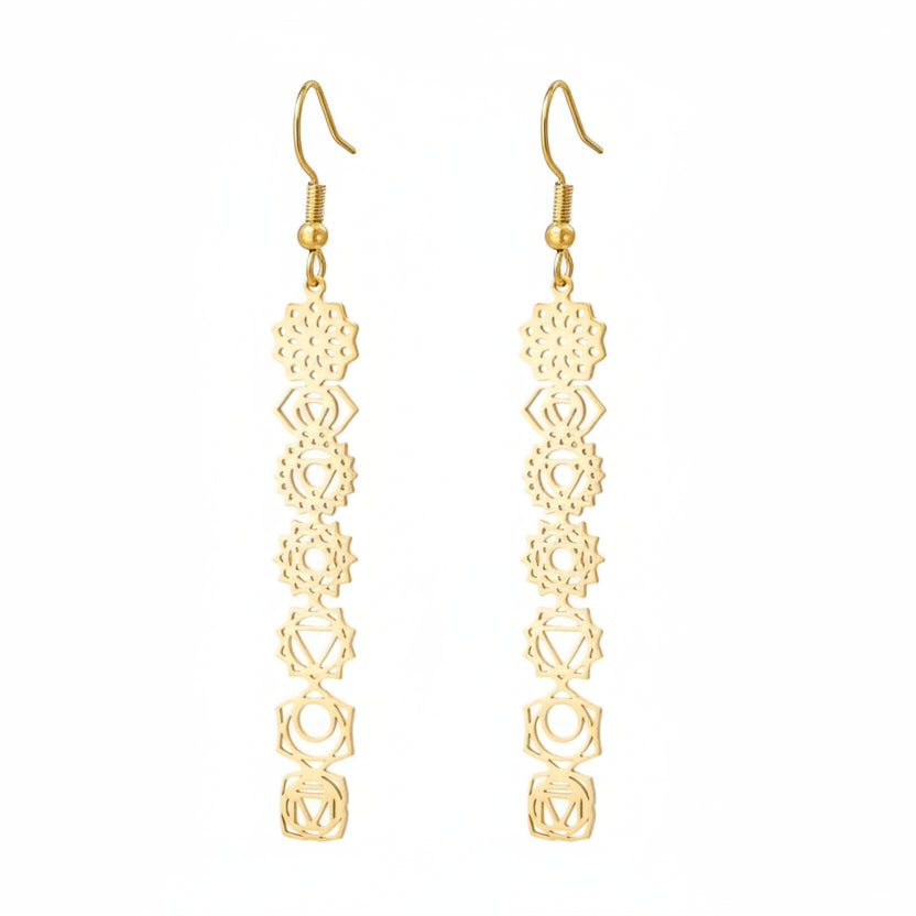 Gold earrings with intricate design on a white background