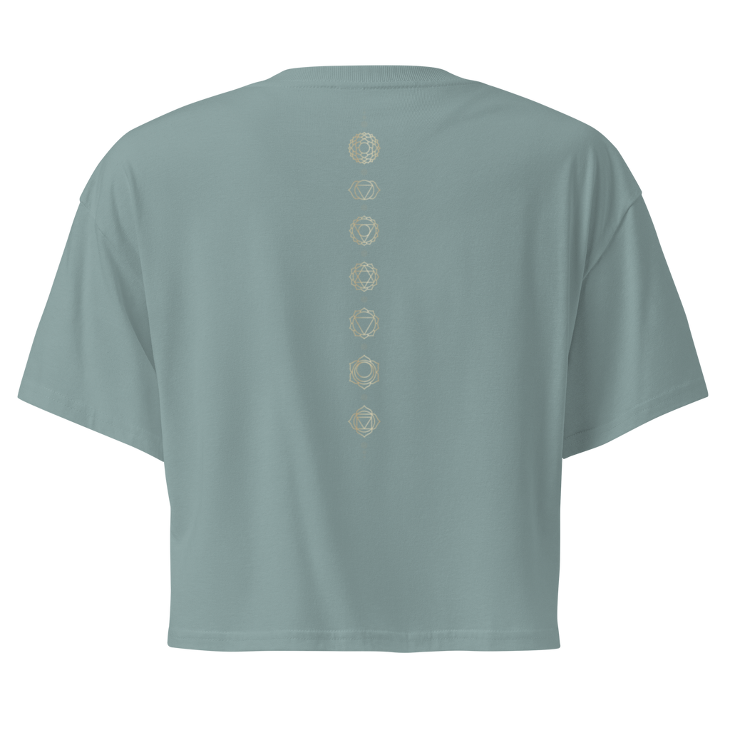 Back of a crop tee showing seven chakra symbols down the spine